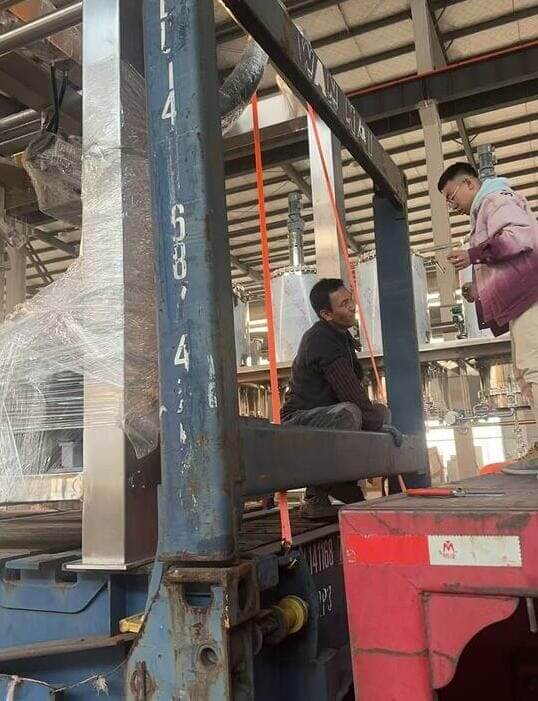 loading 11.7 meter long skid frames into containers